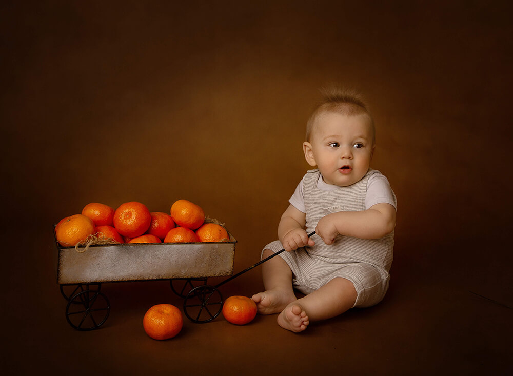Newborn photo with oranges in Newcastle